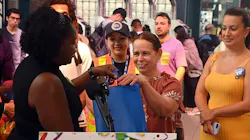 Candida Alfonso receiving her gift bag for being the 1 billionth taper on OMNY. Candida Alfonso receiving her gift bag for being the 1 billionth taper on OMNY.