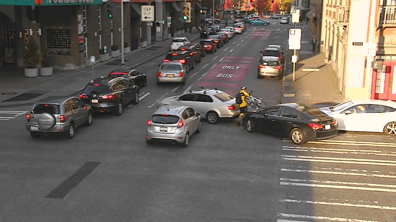 Traffic camera photo of vehicles blocking an intersection in Seattle&rsquo;s Belltown neighborhood.
