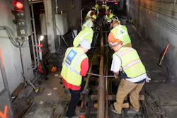 Track crew moving new rail into position by hand in Van Ness Crossover during Fix It Week early subway shutdown. Track crew moving new rail into position by hand in Van Ness Crossover during Fix It Week early subway shutdown.
