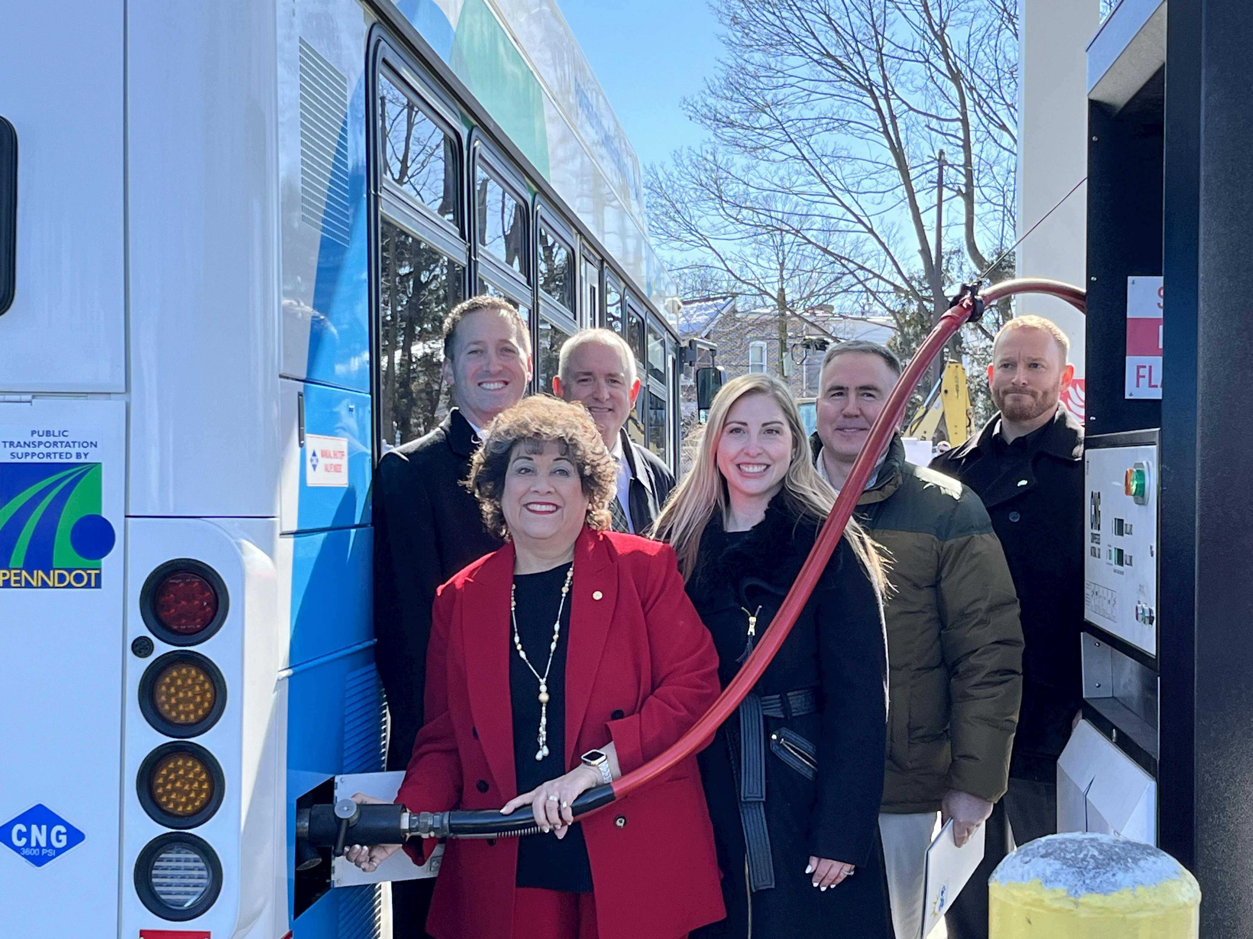 LANTA Executive Director Owen O&rsquo;Neil (rear right) is joined at the &lsquo;first fill&rsquo; event by Shaun Hart, UGIES Vice President (rear left). Front row includes Terry Garcia Crews, Regional Administrator at the Federal Transit Administration; Meredith Biggica, PennDOT Deputy Secretary; John Ryder, PA EPA Deputy Secretary; and LANTA Board Chair Matthew Malozi.