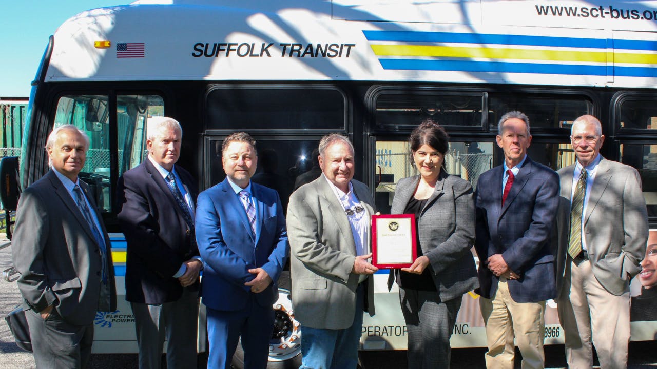 Marisa Maola, TSA regional security director, Surface Region 1, presents the Gold Standard Award to John Corr, CEO, EBT Inc. Joining in the award presentation were (left to right): David DelSanto, TSA surface inspector (JFK); Tim Flood, executive vice president, EBT Inc.; James Rogan, director of safety and training, EBT Inc.; Stephen Collins, TSA surface inspector (JFK) and Kevin Hoban, TSA regional security Inspector, Surface Region 1.