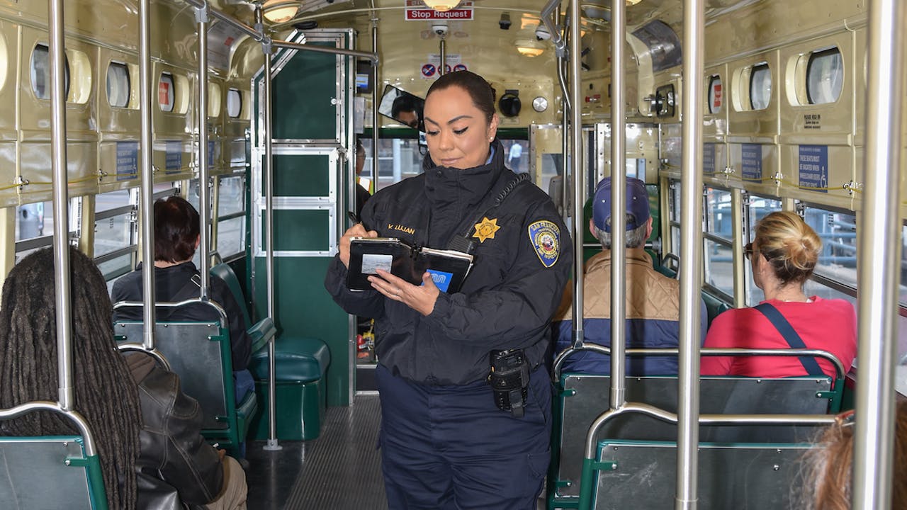 Transit Fare Inspector Veronica Lujan checks fare compliance on the F Market line..