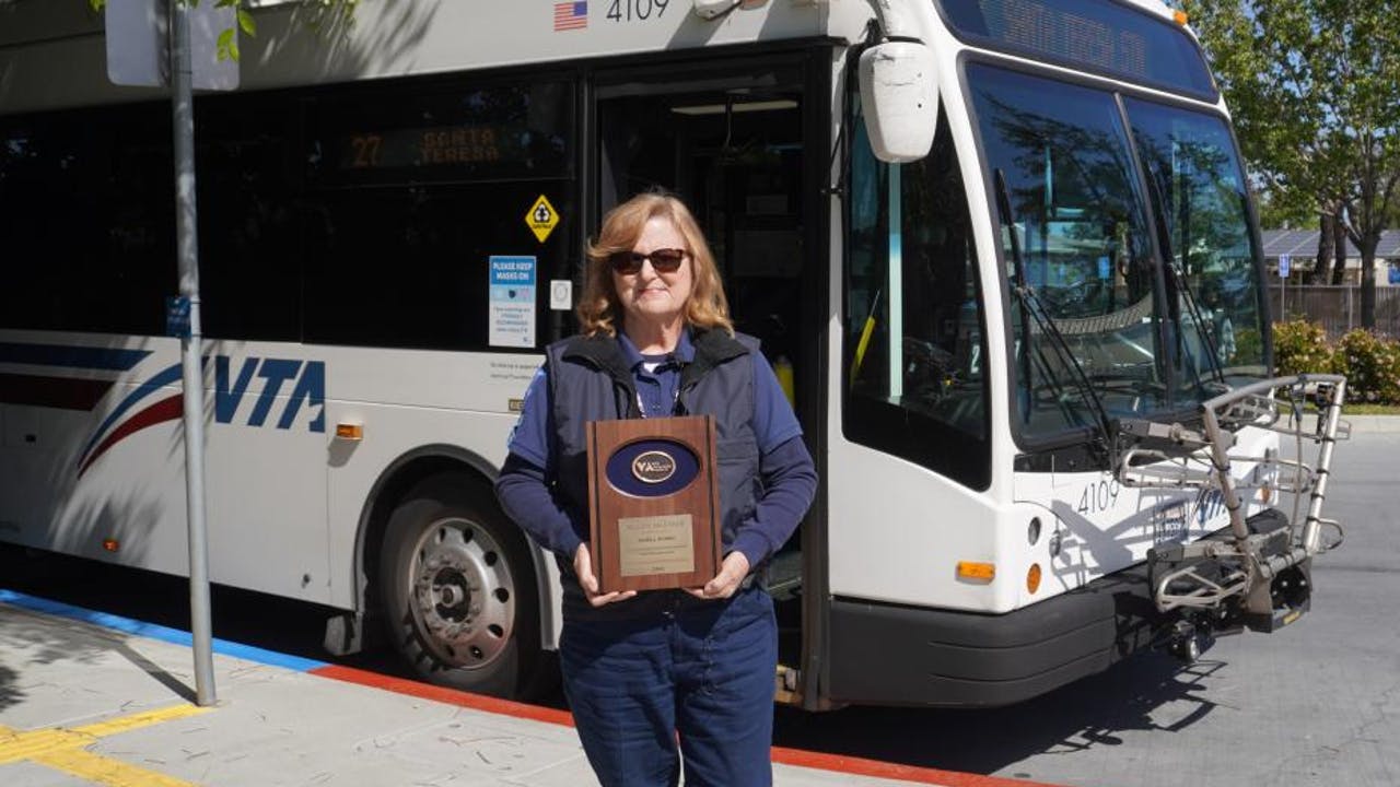 Janell Rubbo with her 4-million-mile recognition plaque.