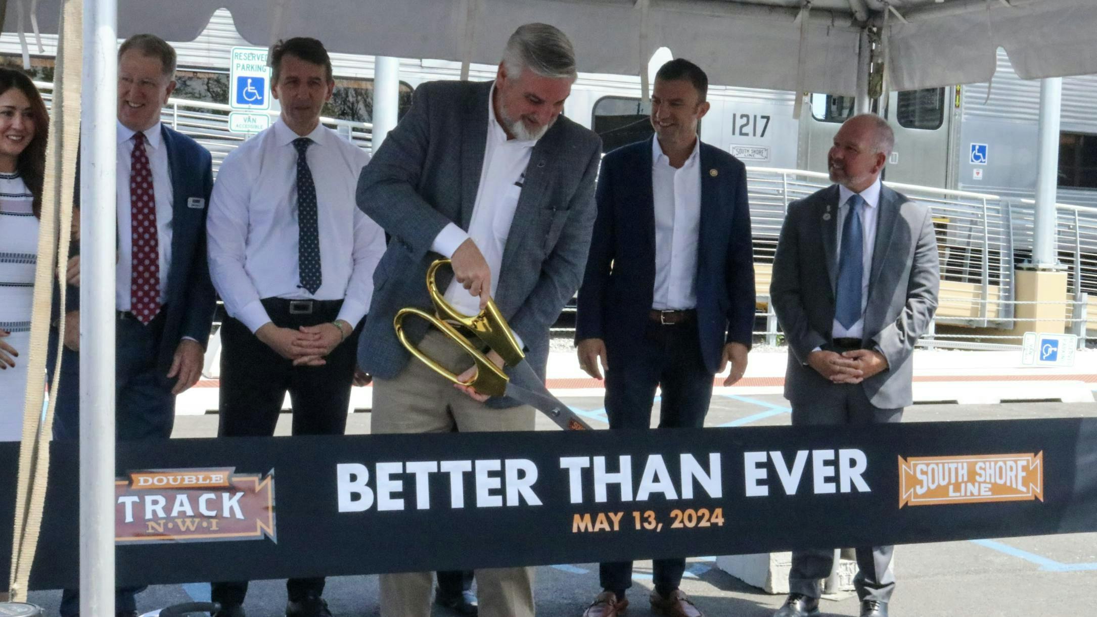 Indiana Gov. Eric Holcomb cuts the ribbon on the NICTD Double Track Northwest Indiana project. The double track project will allow NICTD to run 14 additional weekday trains on the South Shore Line.