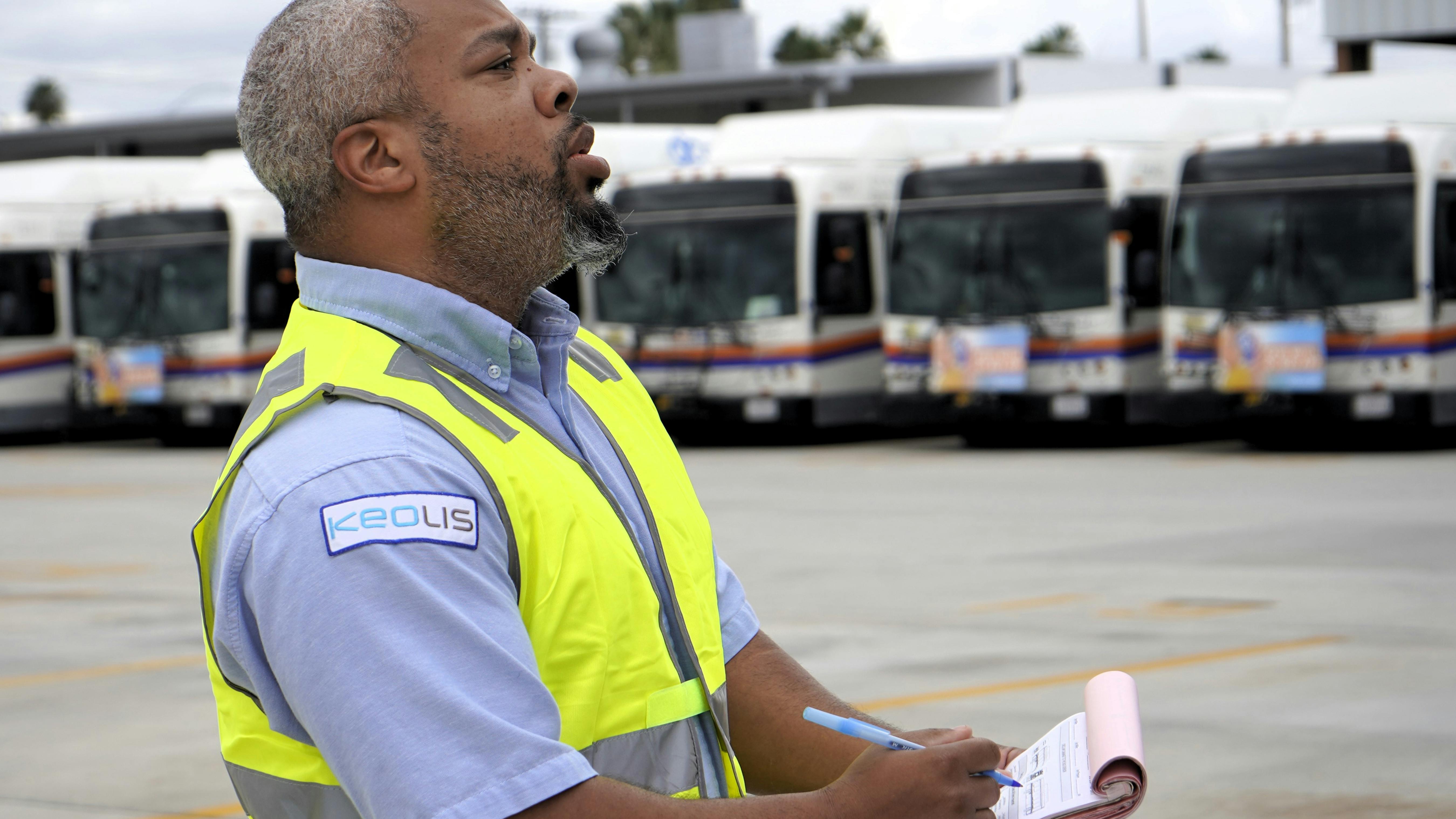 Keolis operator Steven Polite conducts a pre-trip inspection at the OCTA yard in Anaheim, Calif.