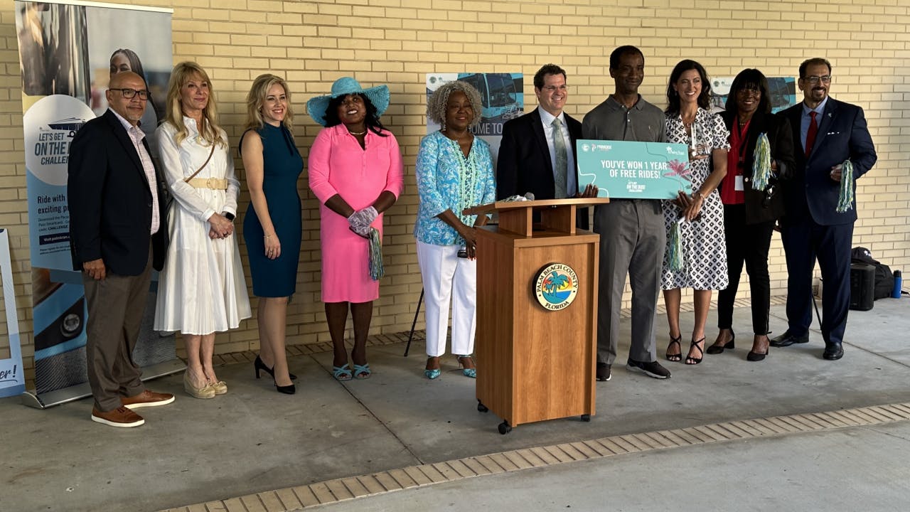 Left to right: Belle Glade Vice Mayor Joquin Almazan, Palm Beach Gardens Mayor Chelsea Reed, Palm Beach TPA Executive Director Valerie Neilson, Palm Tran Service Board Chair Carmencita Mitchell, Palm Beach County Administrator Verdenia C. Baker, Assistant Administrator Todd J. Bonlarron, Top Rider John Harris, Palm Beach County Commissioner Marci Woodward, Palm Beach School Board Member Marcia Andrew and Palm Tran Executive Director Ivan Maldanado.