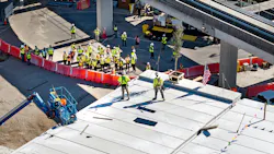 The topping out ceremony signified the last structural beam being raised into place. The topping out ceremony signified the last structural beam being raised into place.