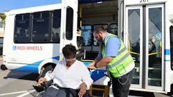 A passenger being let go off of a SamTrans paratransit vehicle. A passenger being let go off of a SamTrans paratransit vehicle.