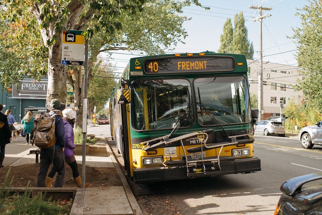People board a Route 40 bus.