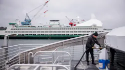Water taxi crew member fuels the Doc Maynard. Water taxi crew member fuels the Doc Maynard.