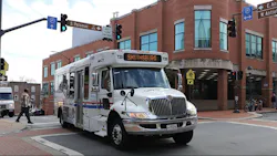 WCT cutaway bus travels down a street WCT cutaway bus travels down a street