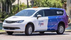 chandler flex-branded mini van parks next to a street curb chandler flex-branded mini van parks next to a street curb