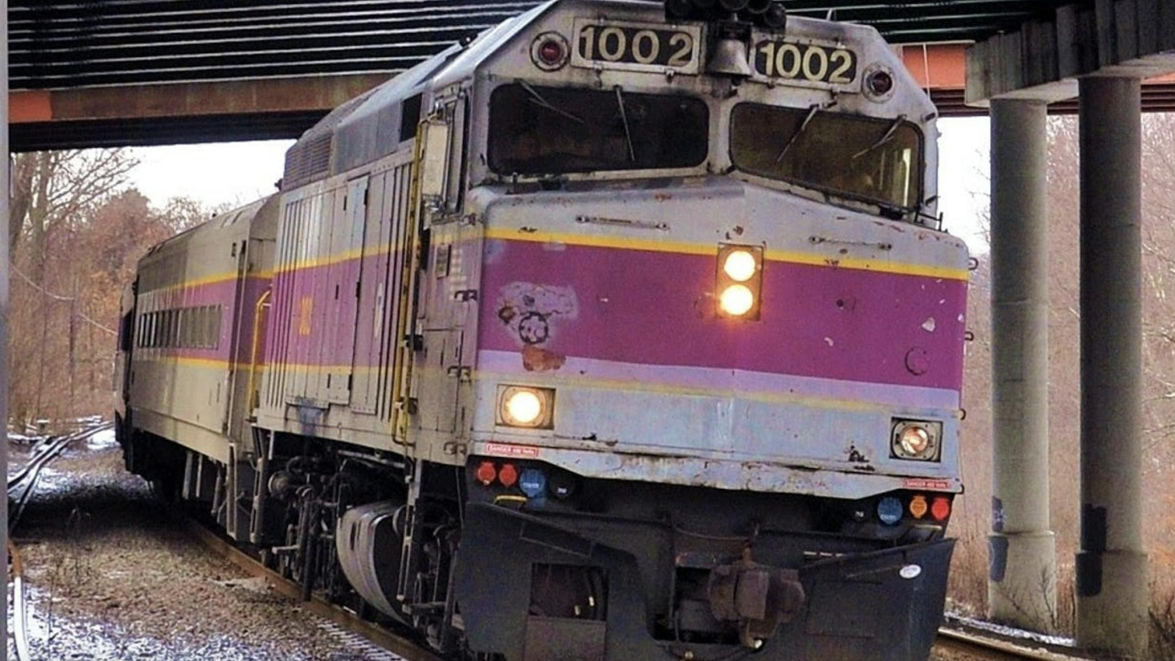 MBTA commuter rail car runs down the track