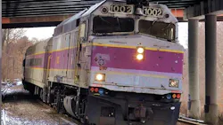 MBTA commuter rail car runs down the track MBTA commuter rail car runs down the track