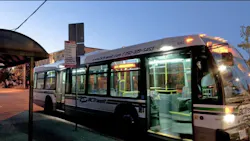 CVRD bus pulls up to bus stop at a curb CVRD bus pulls up to bus stop at a curb