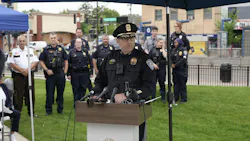 police chief speaks at a podium outside police chief speaks at a podium outside