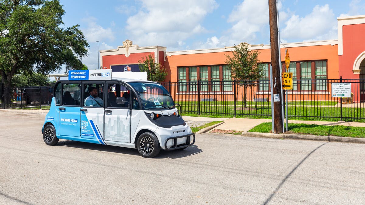 Community Connector branded electric shuttle transports passengers on near northside