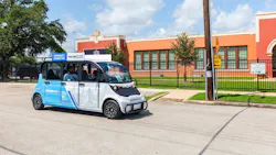 Community Connector branded electric shuttle transports passengers on near northside Community Connector branded electric shuttle transports passengers on near northside