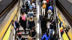 Residents on an escalator in an MTA station. Residents on an escalator in an MTA station.