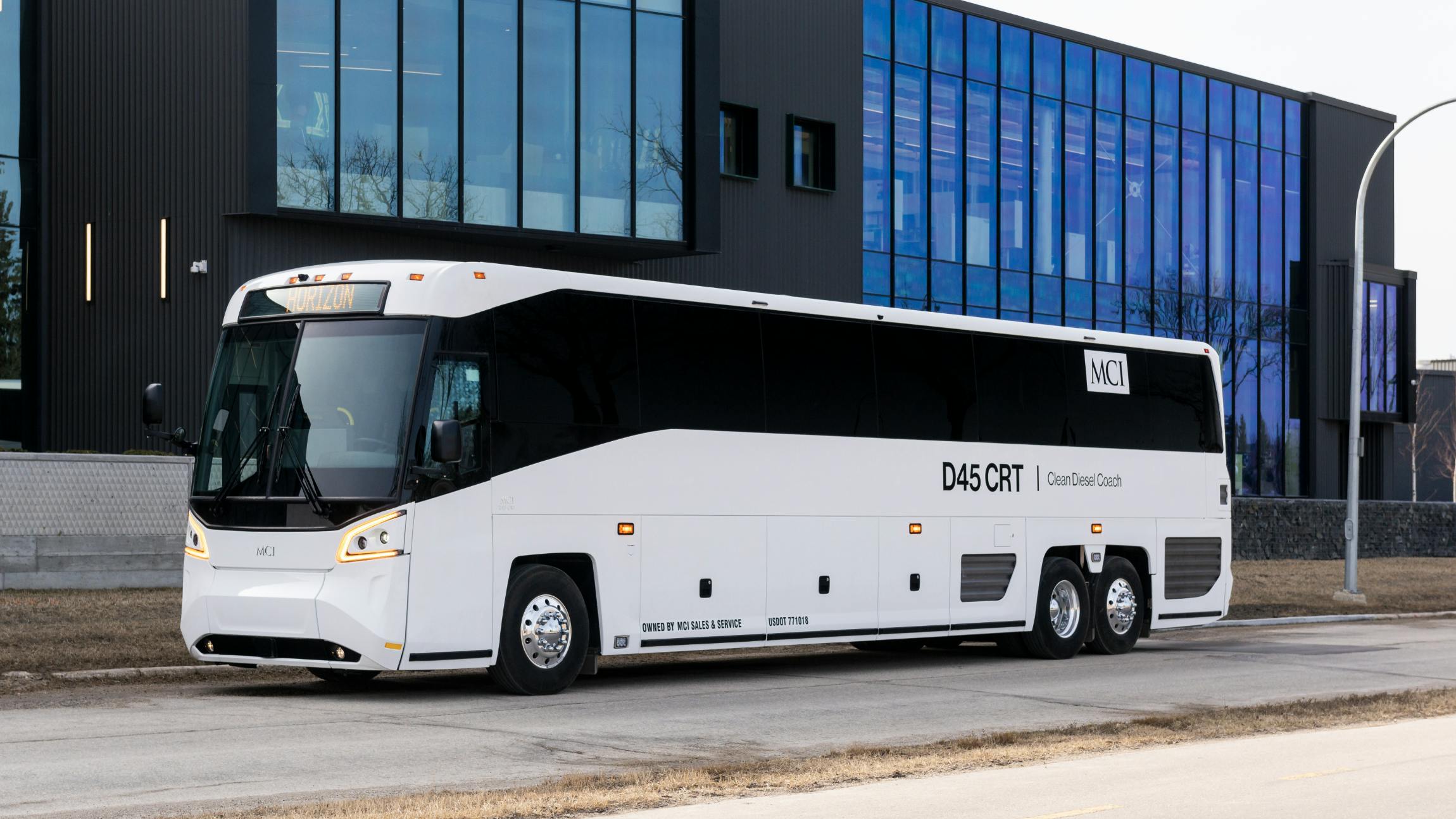 a D45 CRT motorcoach parks on an empty street