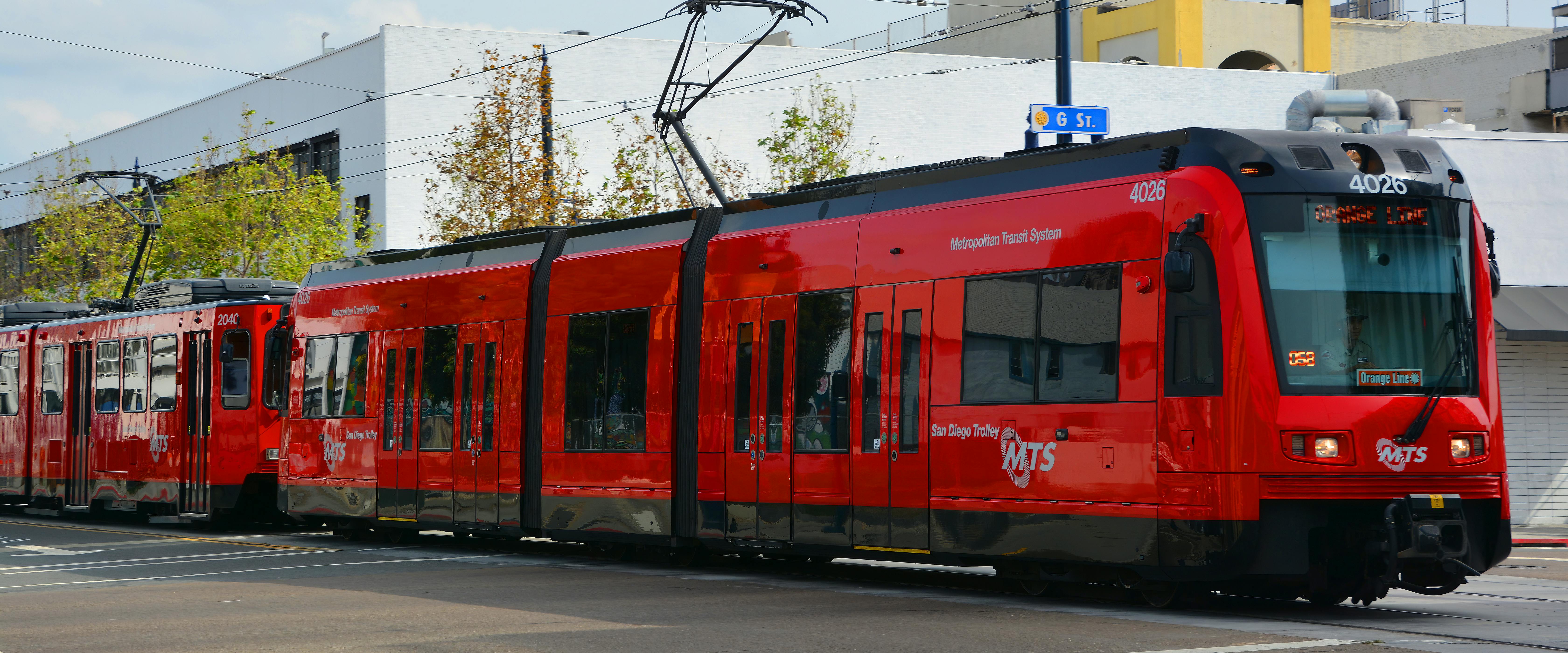 An MTS trolley moves through the street.