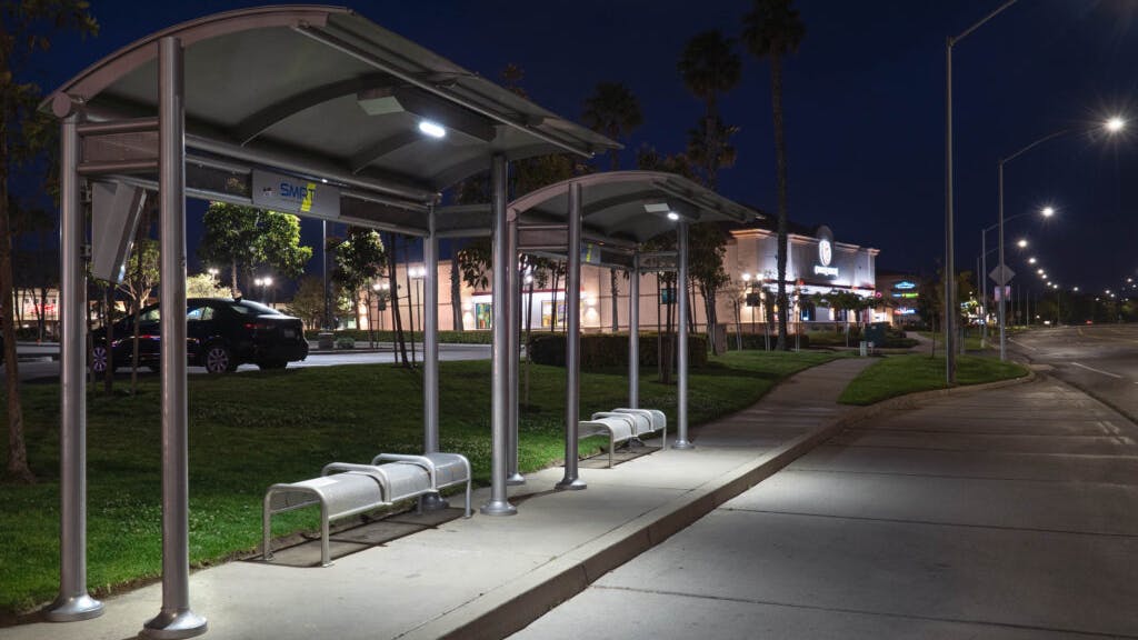 Sunset shelters illuminated at night with solar-powered LED lights.