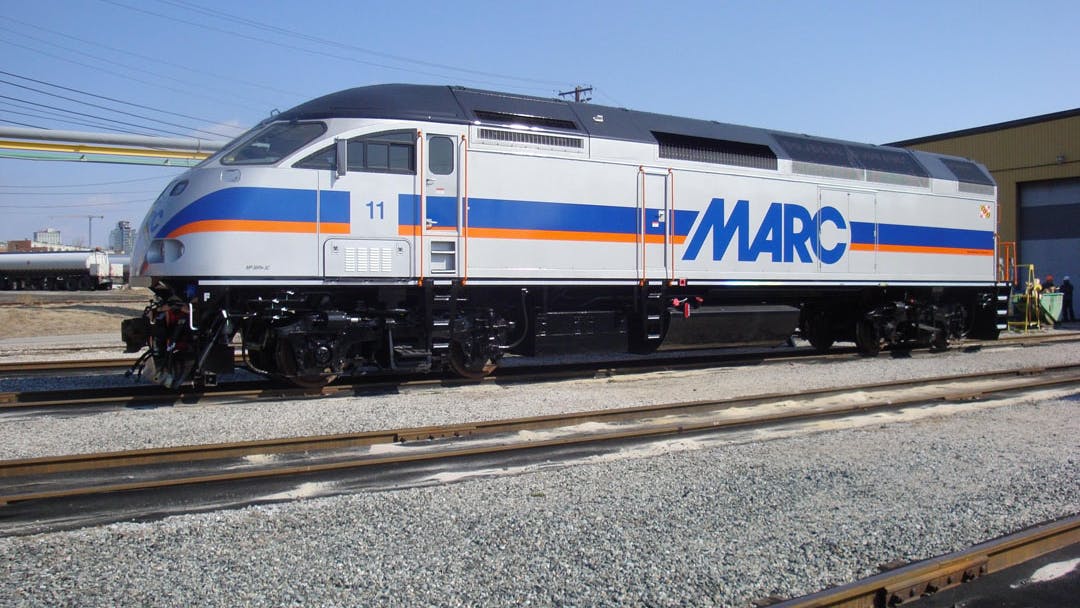 A MARC train sits in a rail yard.