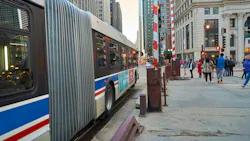 A CTA bus sits at a bus stop. A CTA bus sits at a bus stop.