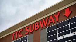 A TTC Subway sign on a brick building. A TTC Subway sign on a brick building.