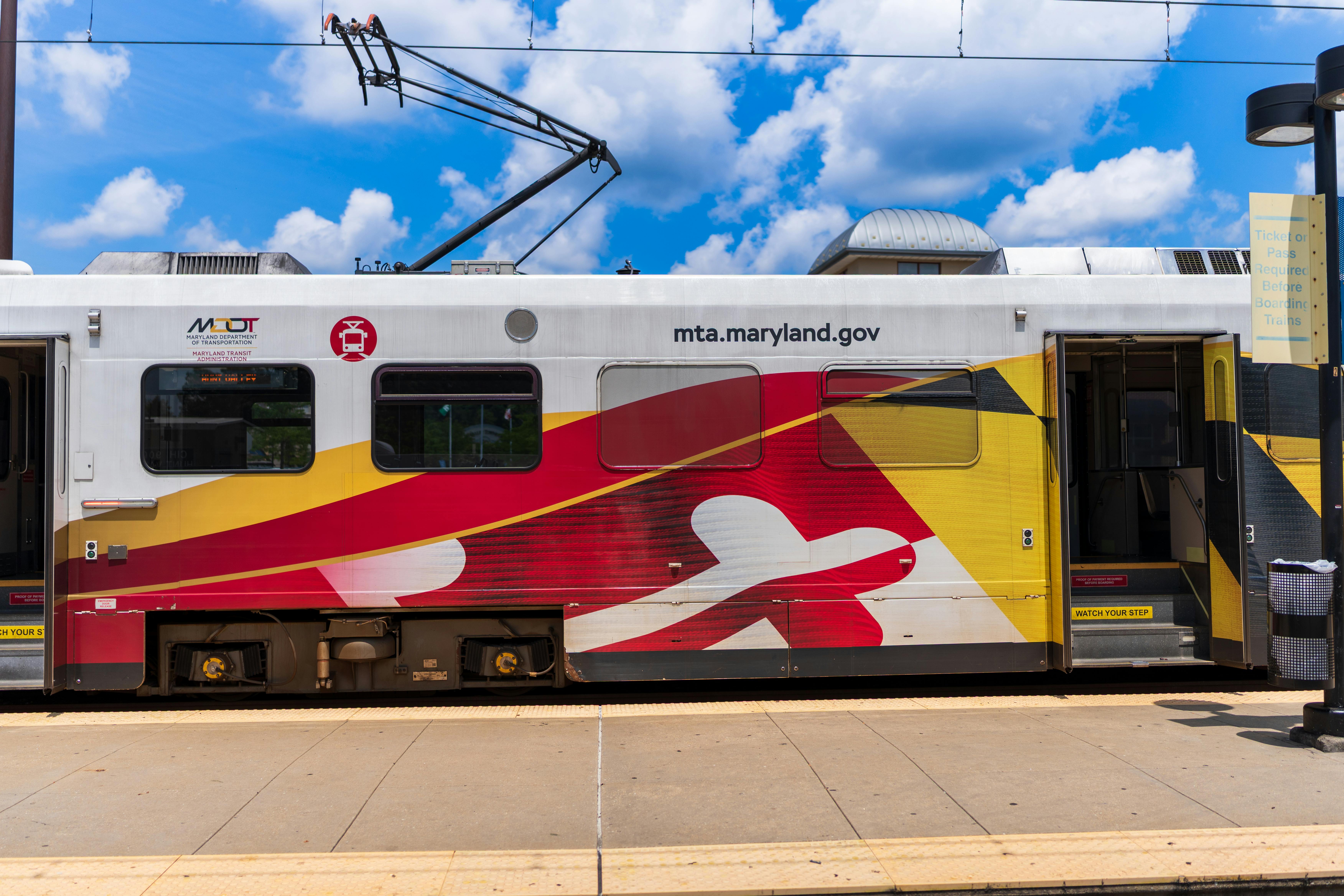 A Maryland Transit Authority train sits at a station.