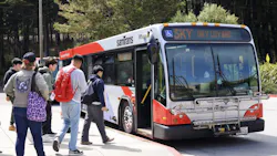 Students getting on a SamTrans bus. Students getting on a SamTrans bus.