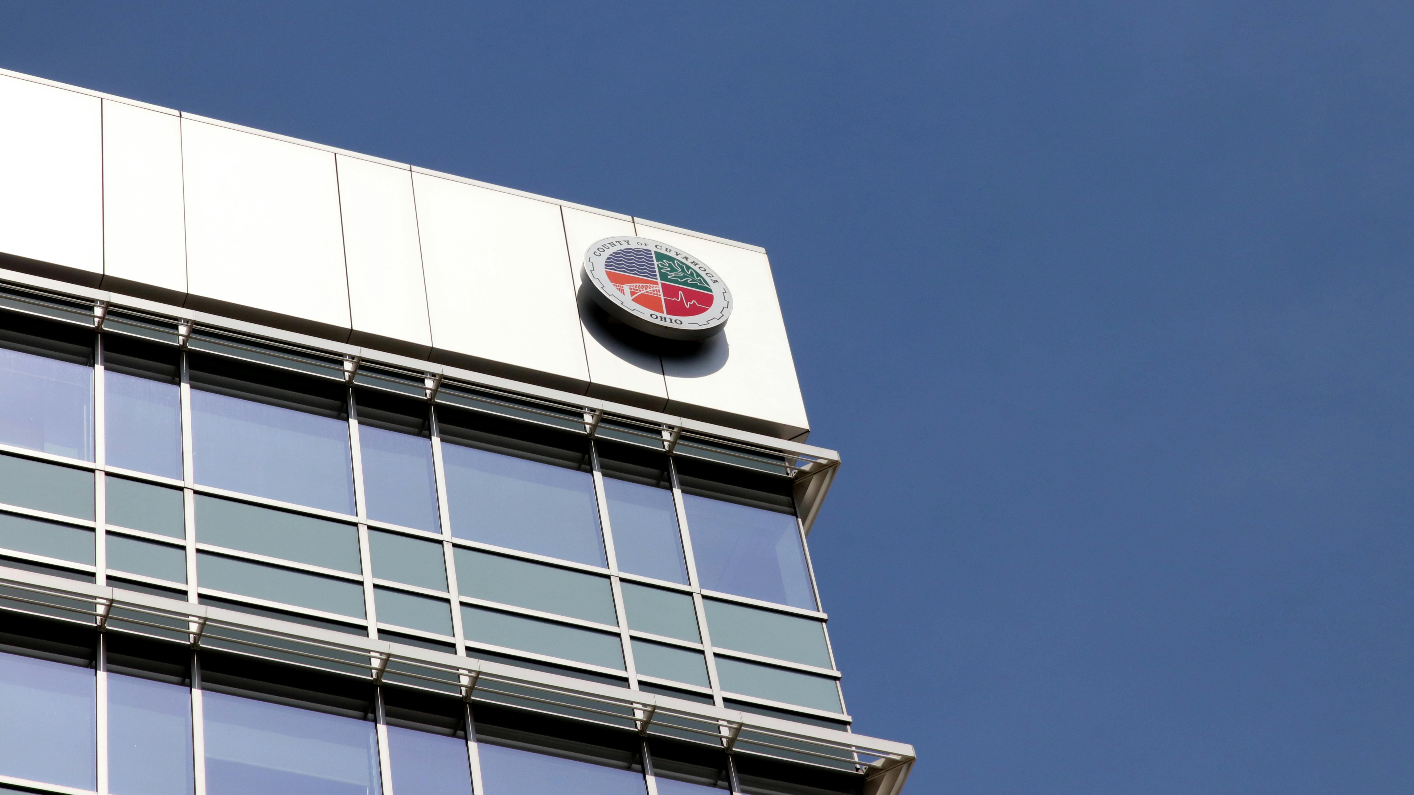 The image shows the Cuyahoga County administrative building logo.