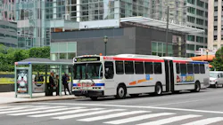a SEPTA bus drives down a city street a SEPTA bus drives down a city street