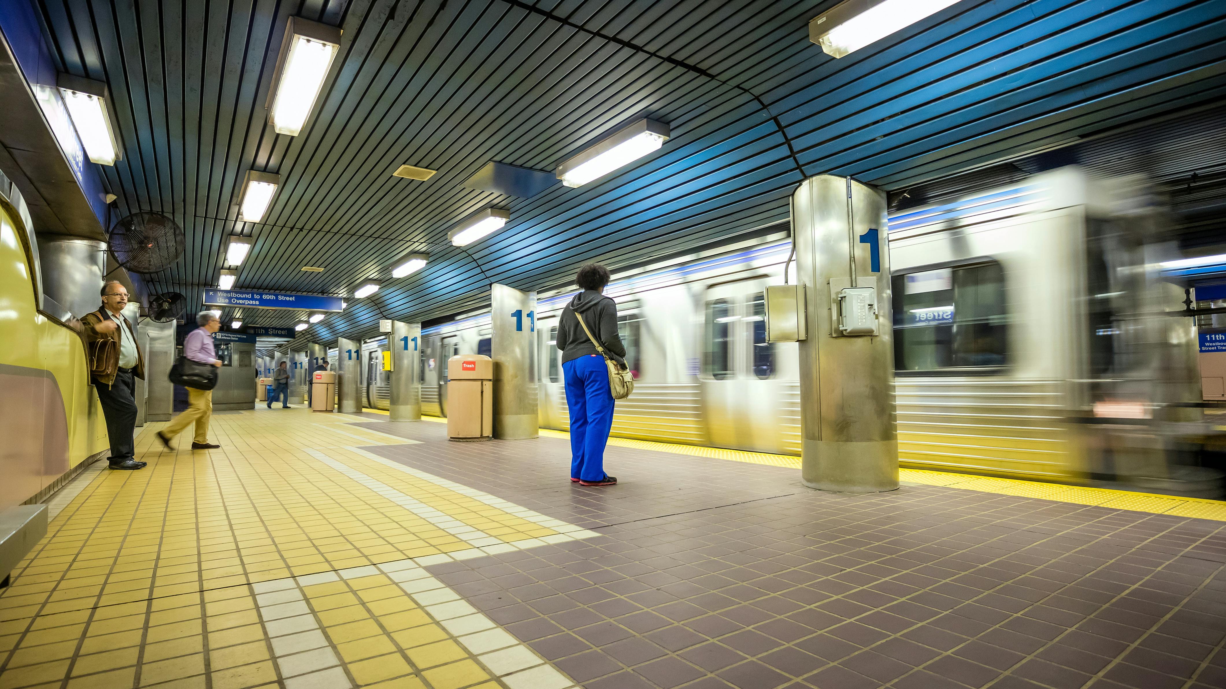 A passenger waits for a SEPTA subway.