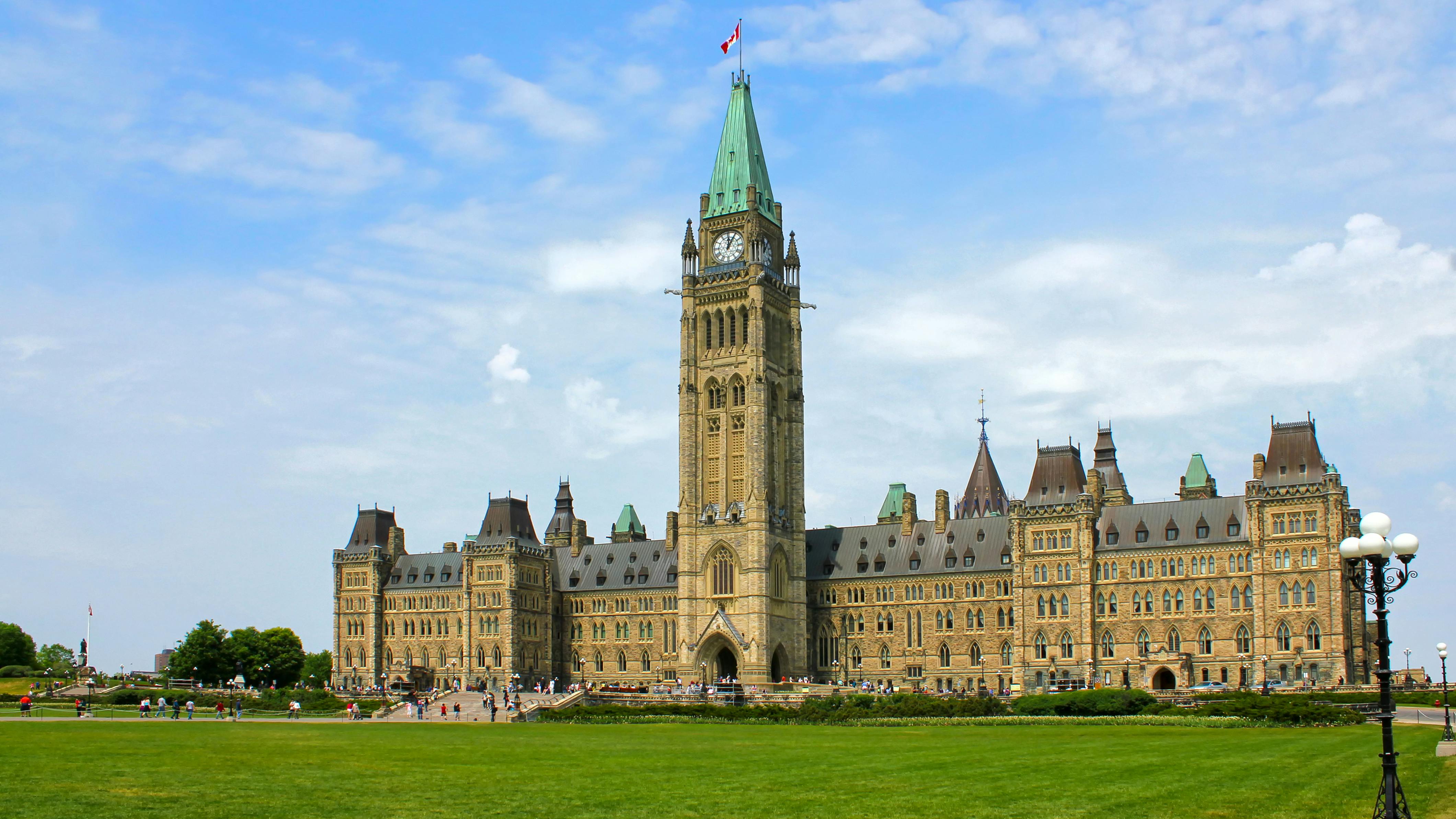 The image displays the Canadian Parliament Hill.