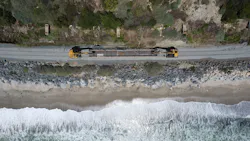 An overhead shot of a train traveling along the LOSSAN coastal rail line. An overhead shot of a train traveling along the LOSSAN coastal rail line.