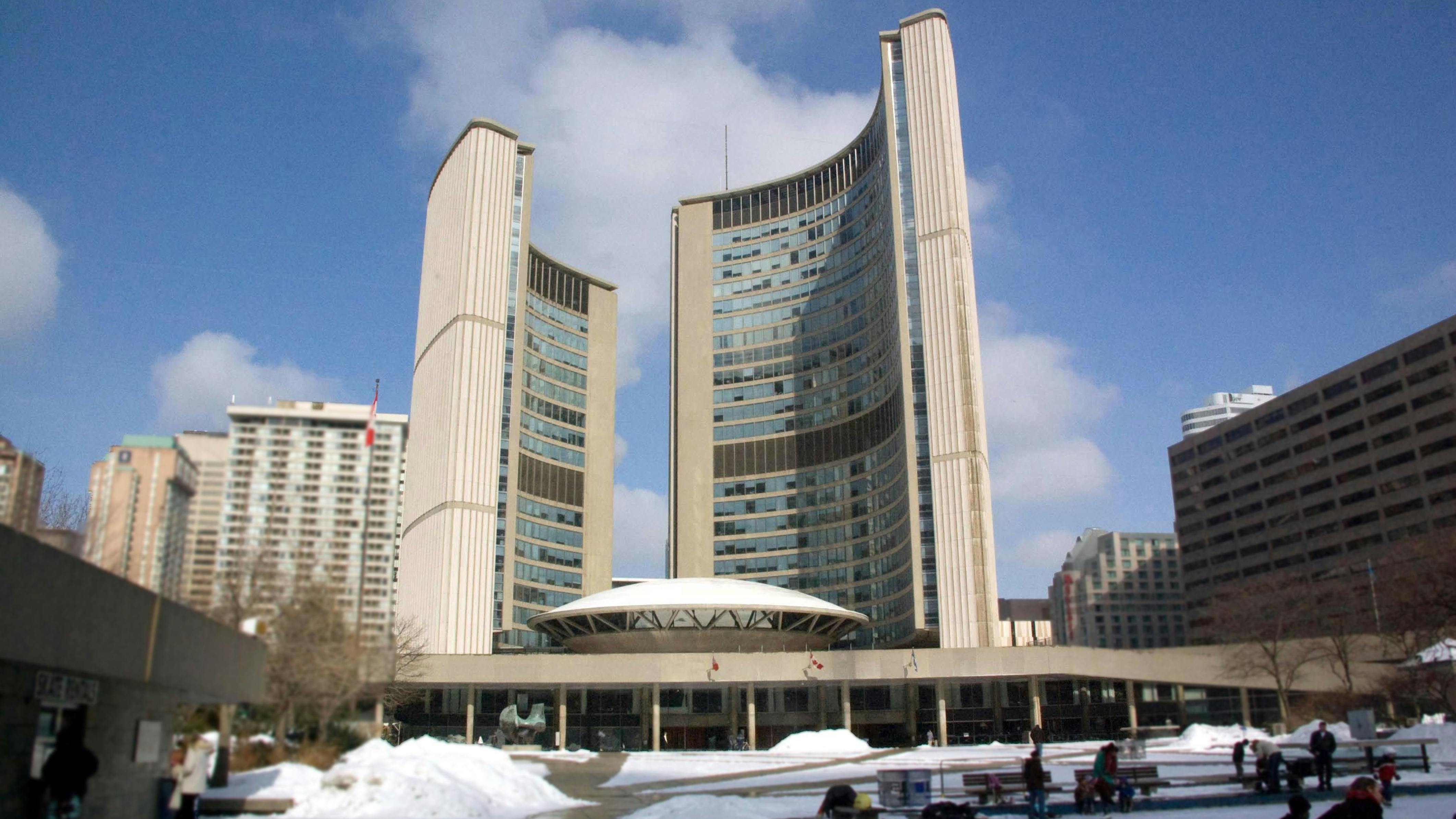 The image displays Toronto City Hall