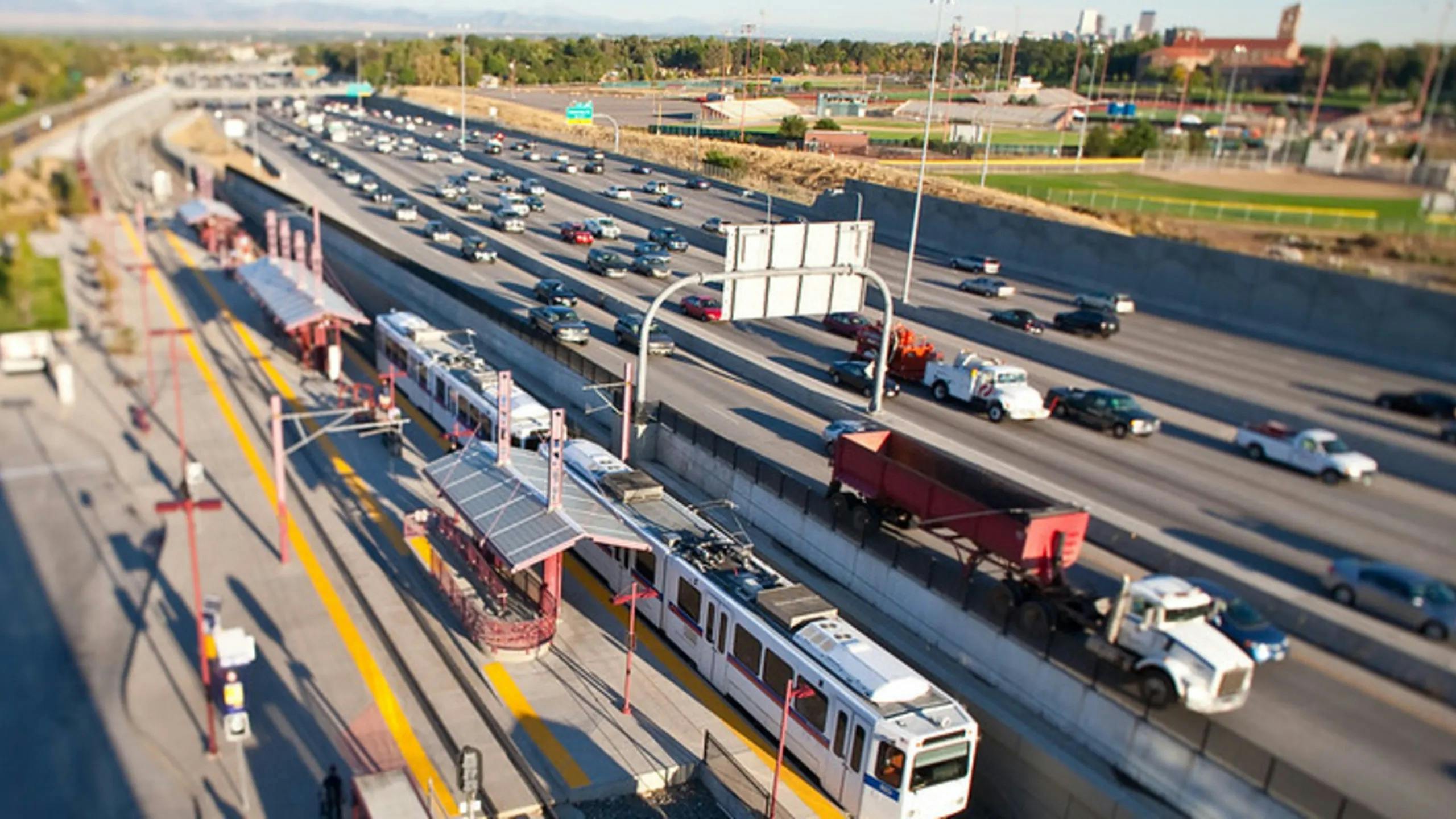 The image displays the Denver RTD E Line University Station.