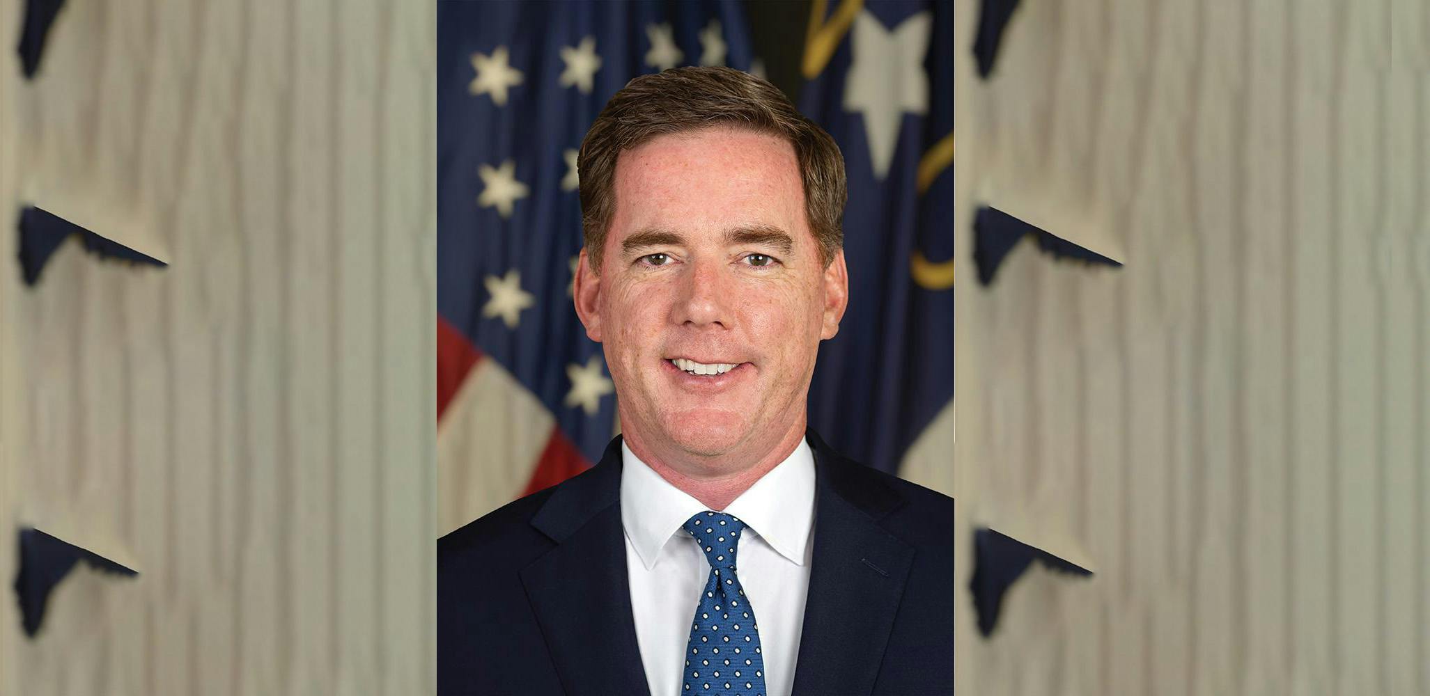 The image displays a headshot of Daniel Johnson.