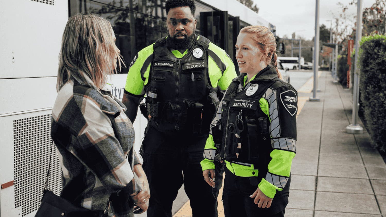 Community Transit Transit Security Officers with a customer.