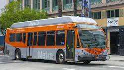 The image shows a L.A. Metro bus driving down a street. The image shows a L.A. Metro bus driving down a street.
