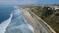 A drone shot of the coastal rail line. A drone shot of the coastal rail line.