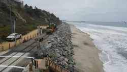 Workers clean up the coastal rail line. Workers clean up the coastal rail line.