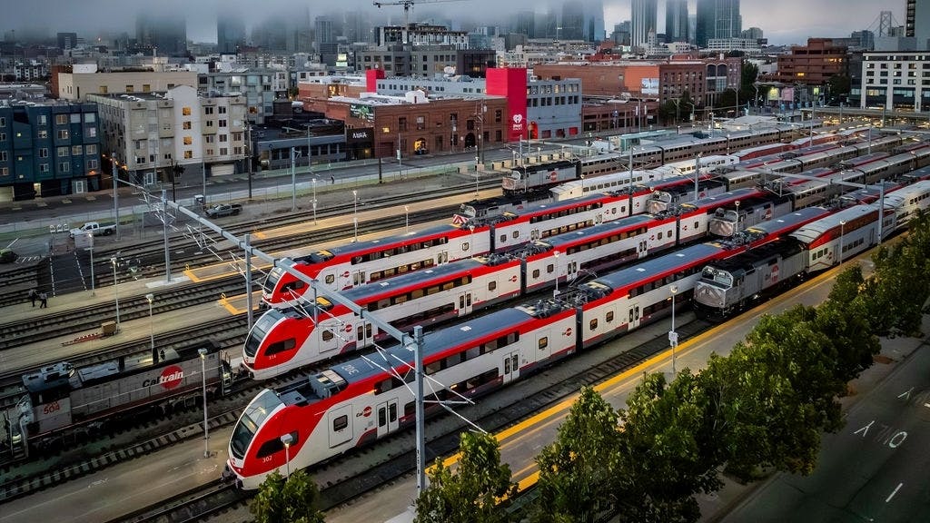aerial view of multiple caltrain trainsets in the rail yard