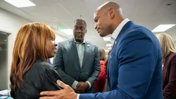 Maryland Governor Wes Moore shakes a woman's hand. Maryland Governor Wes Moore shakes a woman's hand.