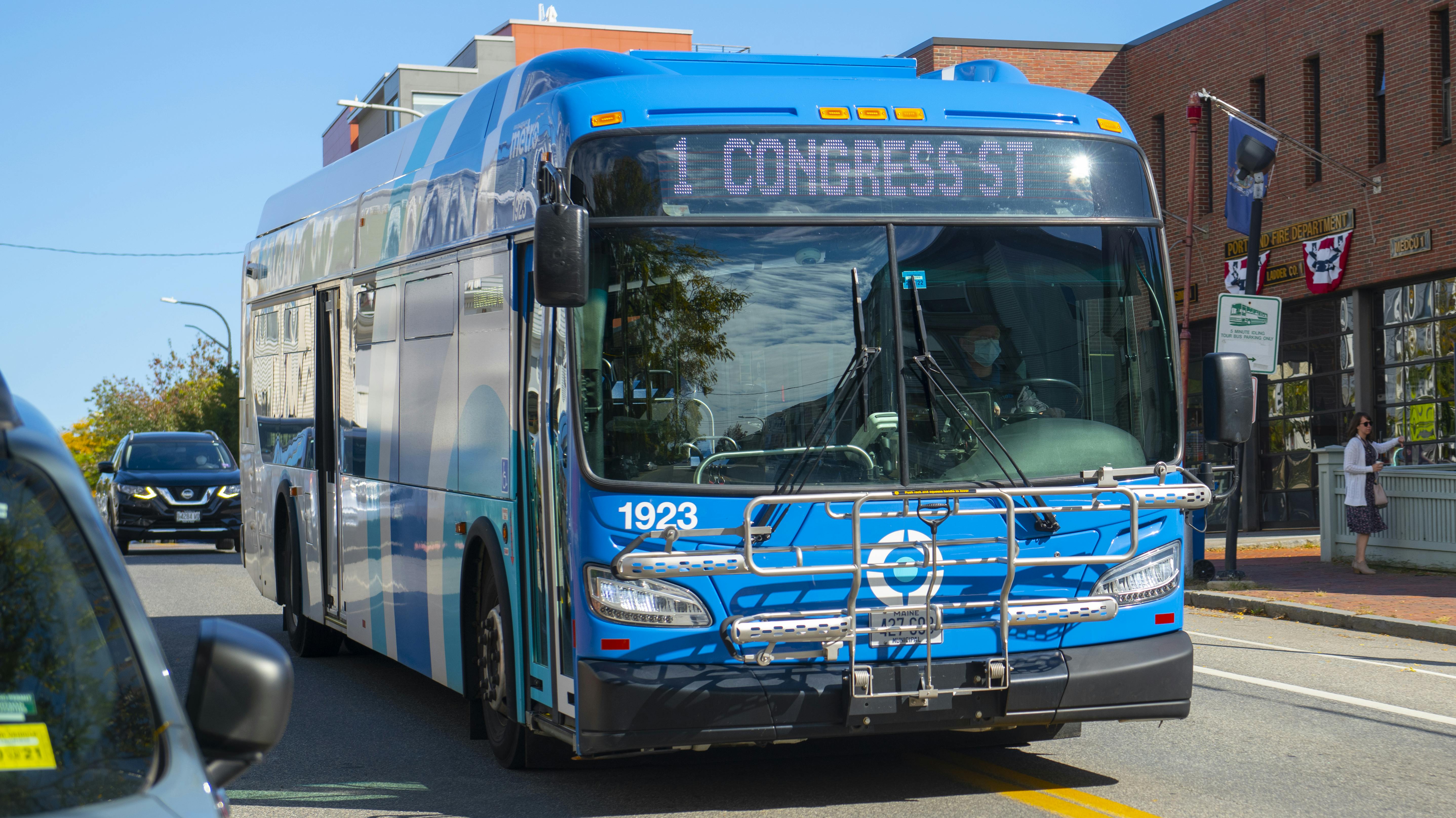 A Greater Portland Metro bus drives down a street.