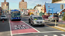 An MTA bus comes to an intersection in a bus-only lane. An MTA bus comes to an intersection in a bus-only lane.