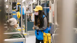 sound transit safety ambassador on rail vehicle interacts with rider sound transit safety ambassador on rail vehicle interacts with rider