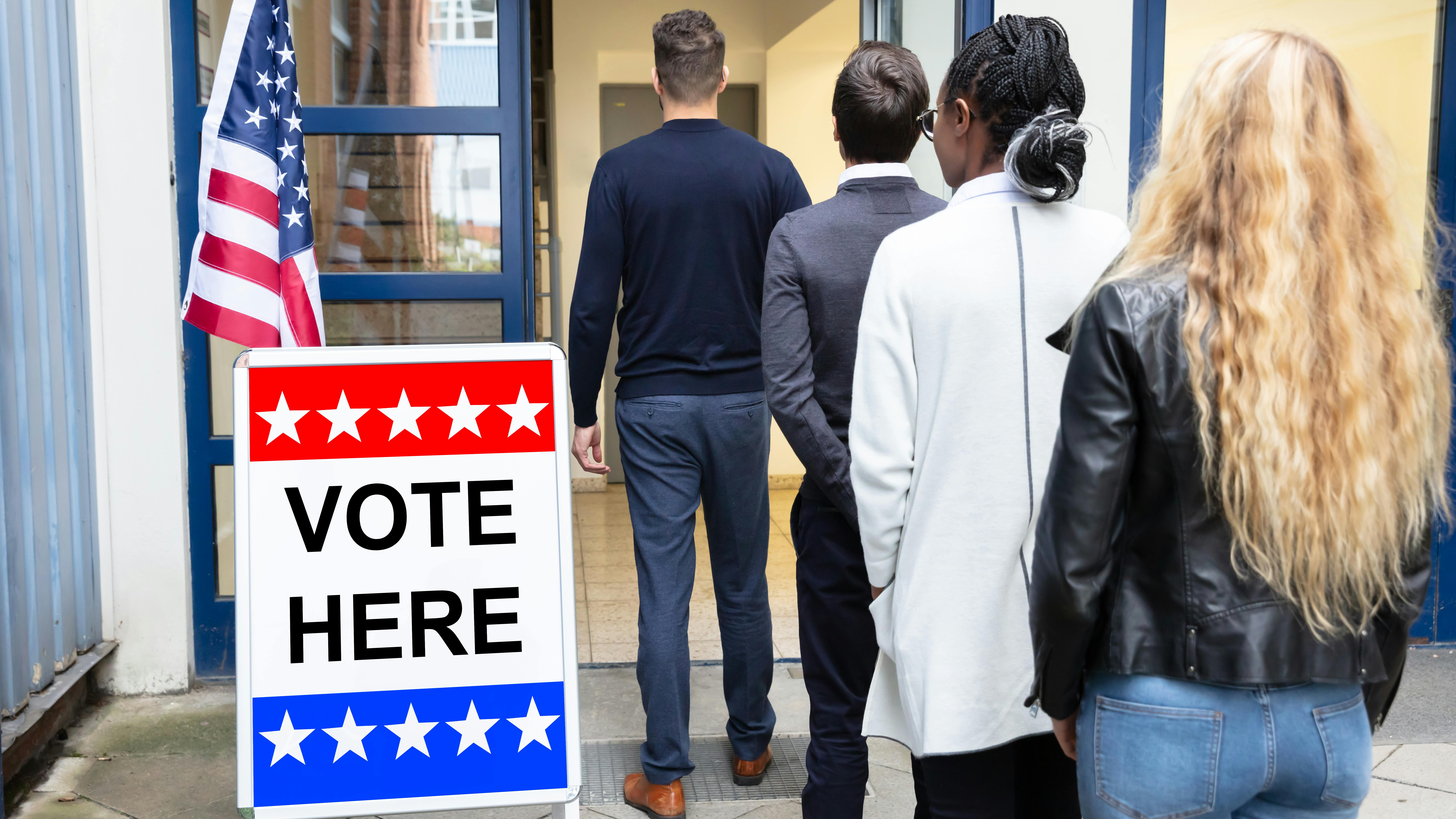 Voters wait to enter the poll.