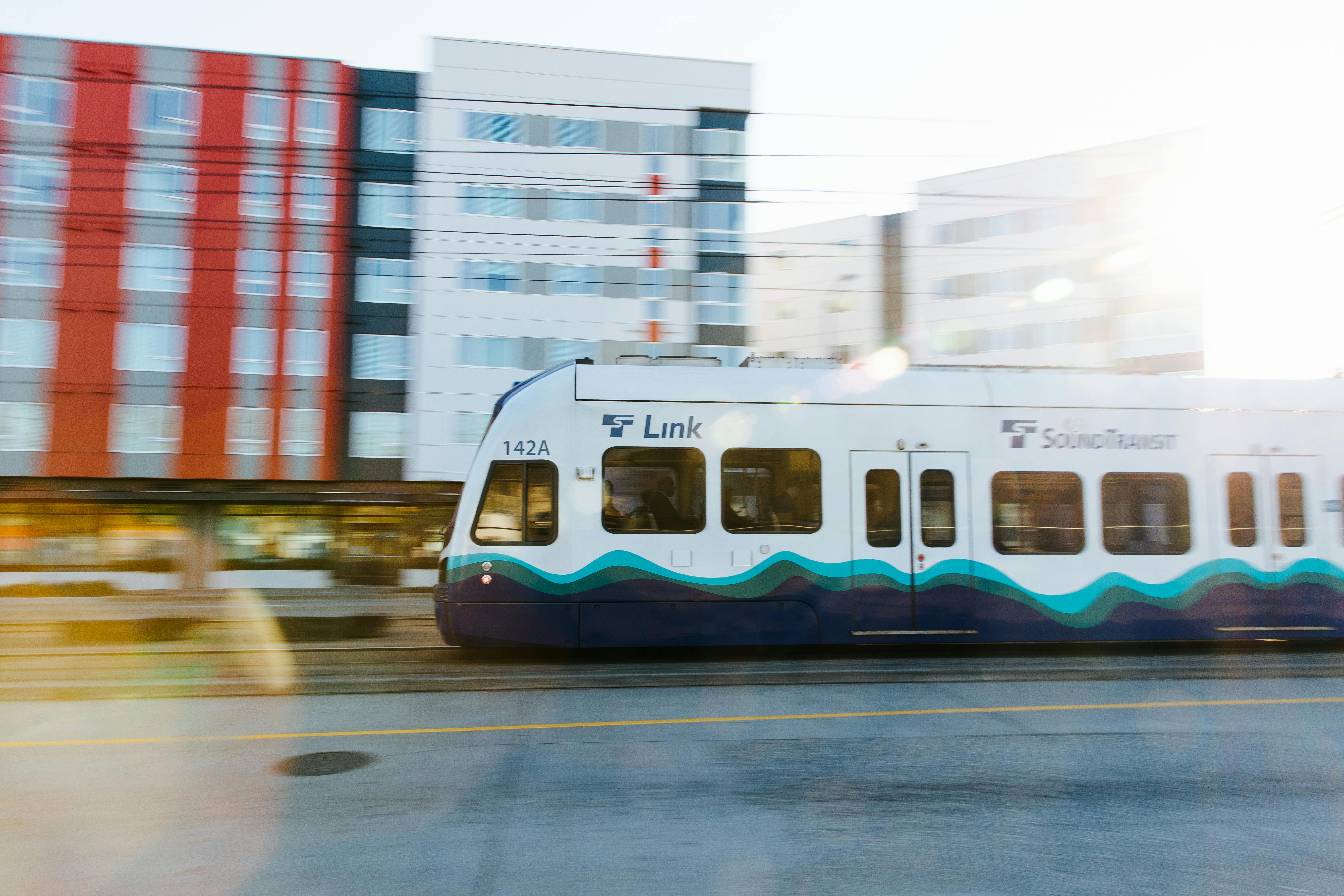The image shows a Sound Transit train running down the track.